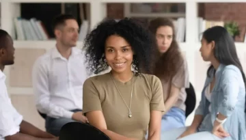 African american female psychologist psychotherapist looking at camera