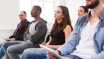 Group of people sitting at seminar